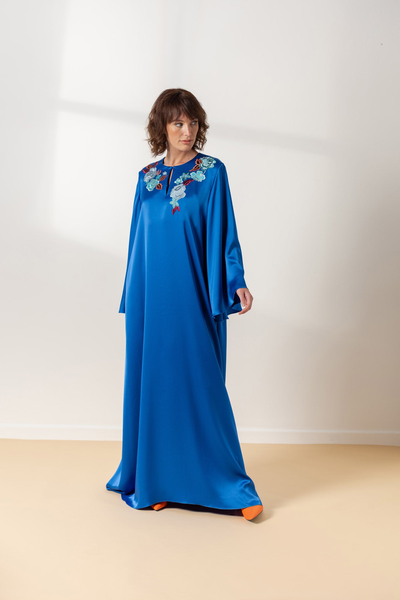 Blue evening dress with floral embroidery